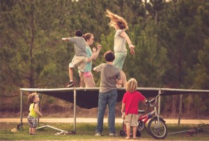 small people on trampoline